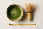 使用场景与套装潜力	构图： 俯拍。将抹茶碗与一支竹筅、一把竹勺并排放在一张浅色大理石桌（暗示您的另一产品线）上。风格： 聚焦于仪式感，强调它是“套装”的一部分，而非单一产品。	提升 AOV (Average Order Value) 的捆绑潜力